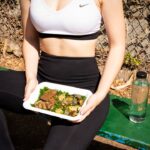 woman wearing white and black Nike sports bra