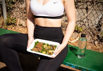 woman wearing white and black Nike sports bra